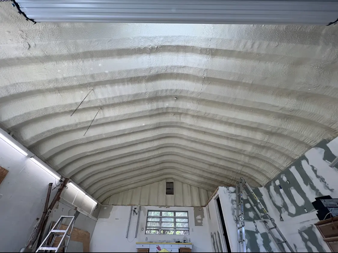 Spray polyurethane foam applied to the underside of a metal roof deck in Summerlin South